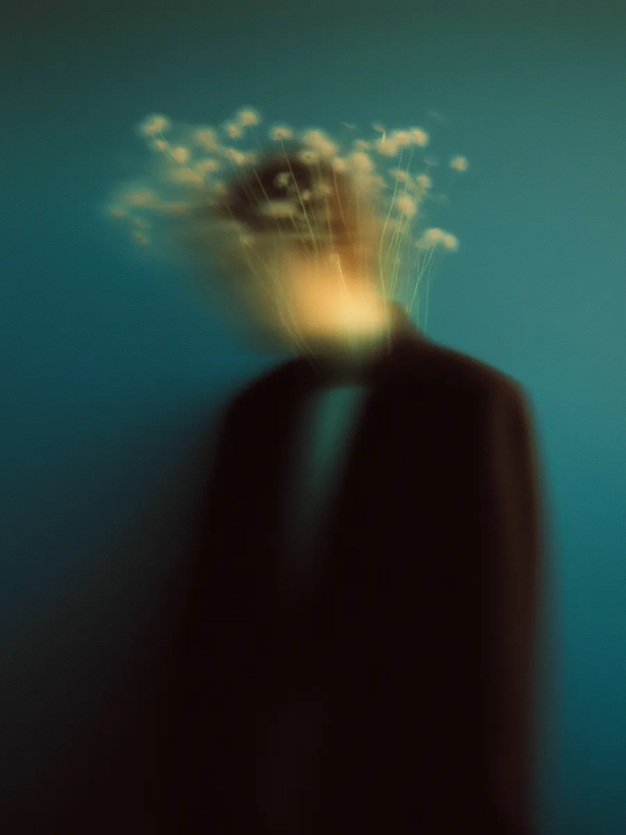 Soft-focus floral image with warm light illuminating tiny blossoms.